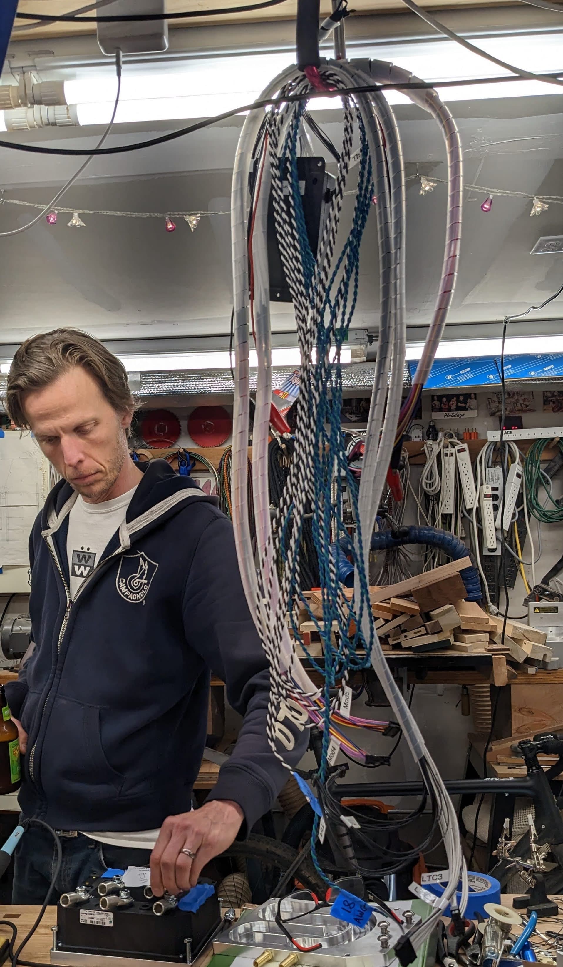 Thor Denmark at work on his electric conversion car